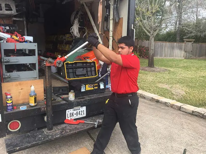 Houston master plumber in Santhoff Plumbing truck
