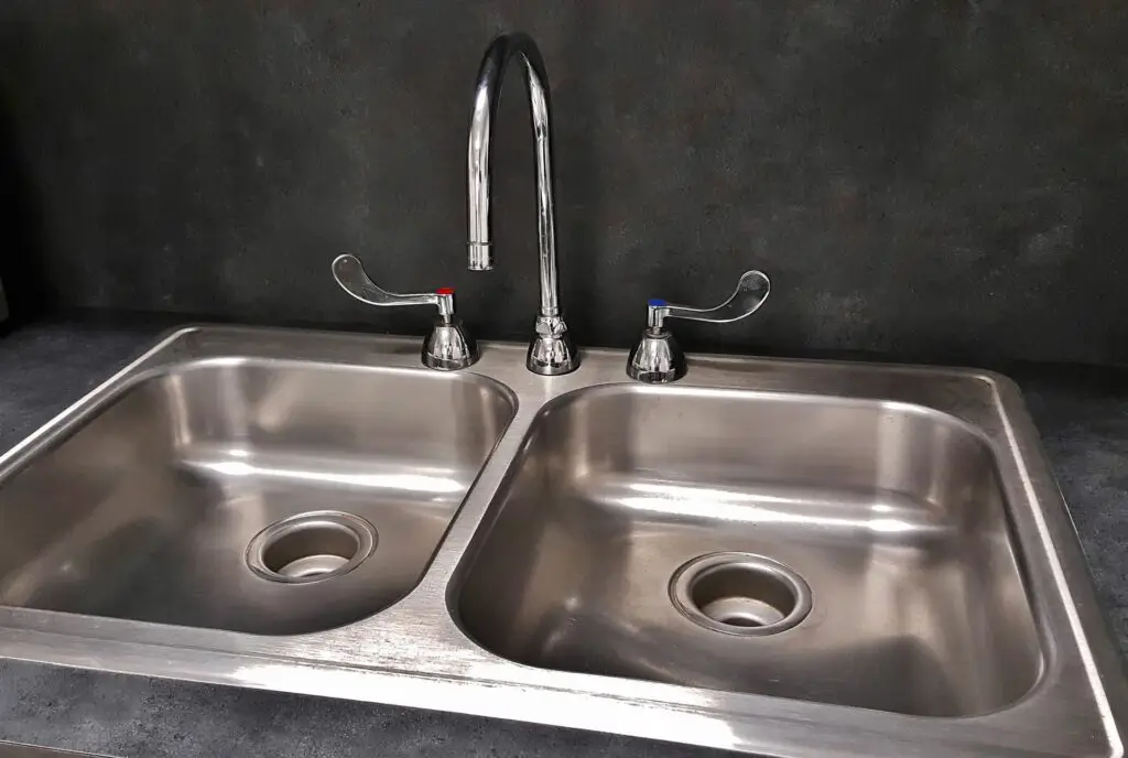 Kitchen sink with broken garbage disposal needs repair from Houston plumber
