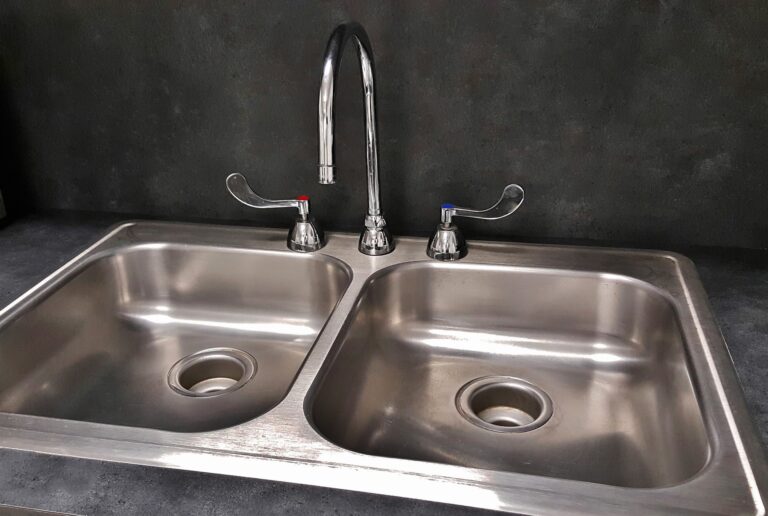 Kitchen sink with broken garbage disposal needs repair from Houston plumber