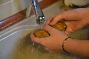 Peeling potatoes into garbage disposal