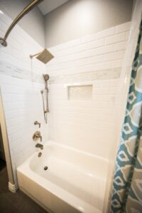 White bathtub and shower - needs Houston bathtub repair for leaks