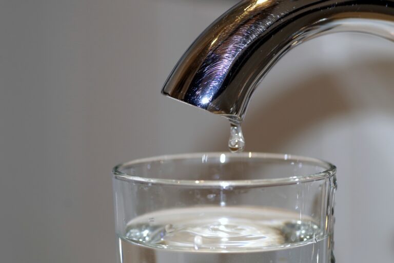 water in glass from faucet call houston emergency plumber for suspected water quality issues