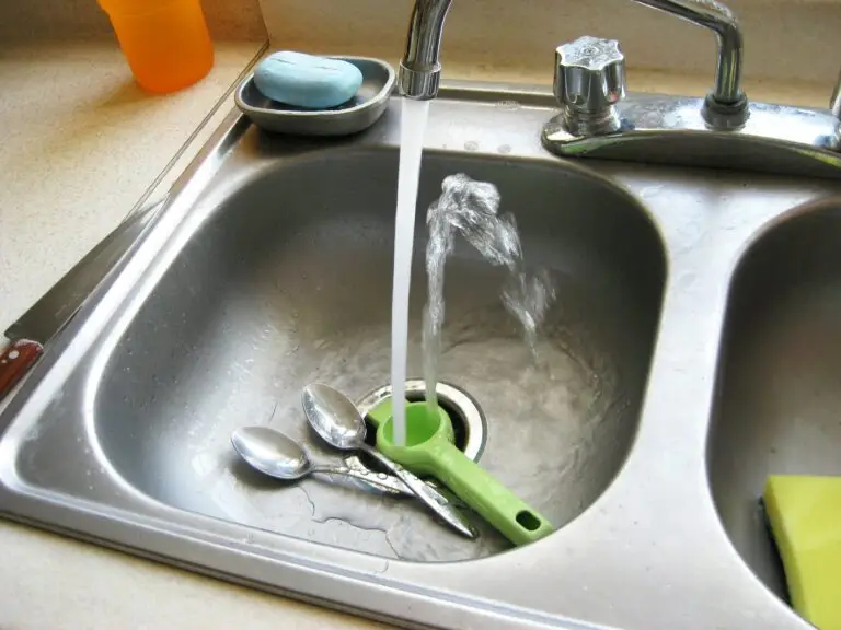 kitchen sink water running needs faucet repair from a Houston plumber