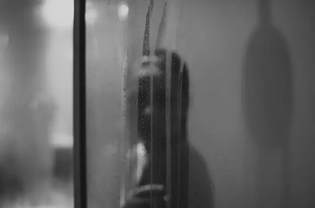 woman enjoying steam shower after Houston bathroom remodeling project with Santhoff Plumbing