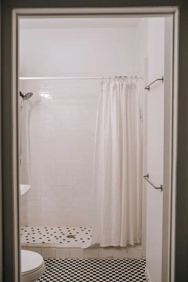 Shower with drain clog needs professional Houston plumbing repairs