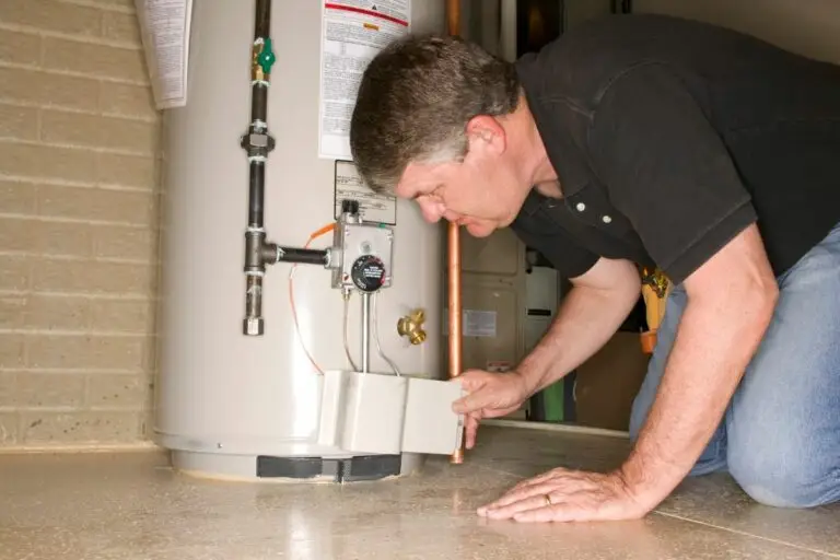 Houston emergency plumber inspecting leaky water heater