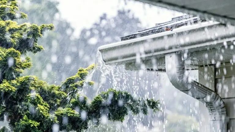 Rain pouring on roof that may damage plumbing and require Houston emergency plumber