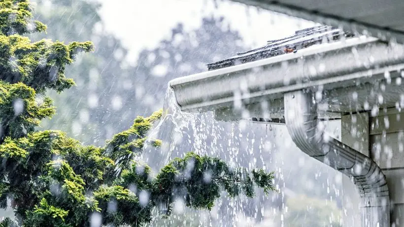 Rain pouring on roof that may damage plumbing and require Houston emergency plumber
