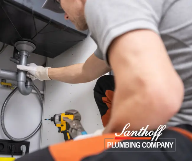 plumber fixing a drain